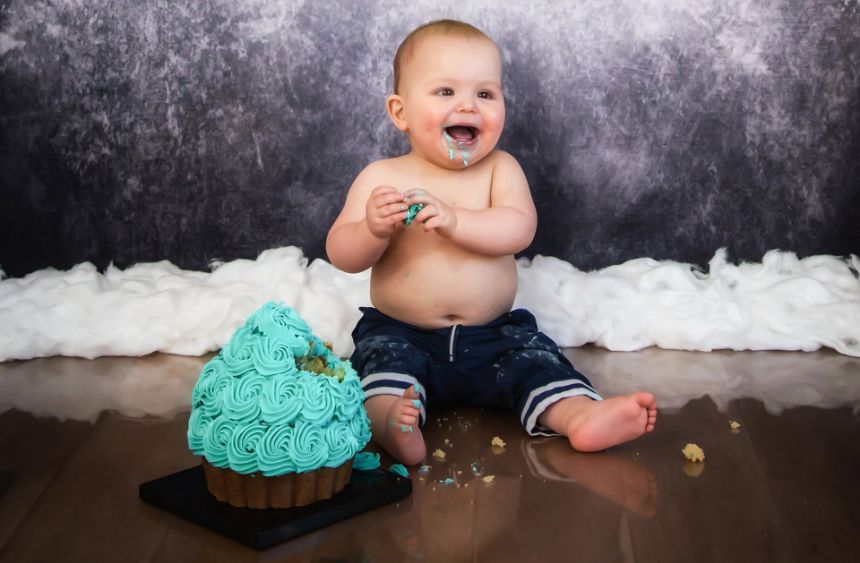 happy baby eating cake