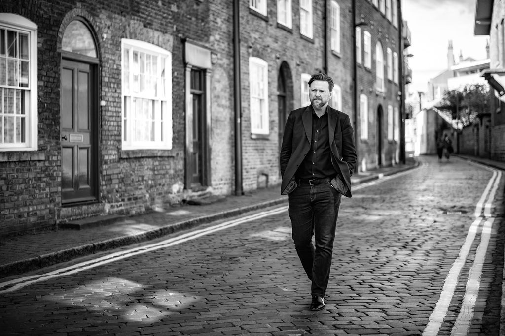 man walking in street